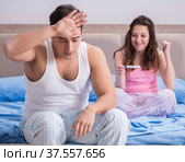 Young family with pregnancy test results. Стоковое фото, фотограф Elnur / Фотобанк Лори