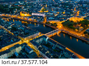Evening aerial view of Laval with buildings, river Mayenne and old bridge. Стоковое фото, фотограф Яков Филимонов / Фотобанк Лори
