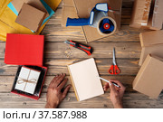 Packing products for delivery on wooden table, top view. Стоковое фото, фотограф Сергей Толмачёв / Фотобанк Лори