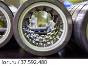Bearing manufacturing plant. Close up of roll bearing. Low depth of field. Third row roll's in focus. Стоковое фото, фотограф Alexey Rezvykh / Фотобанк Лори