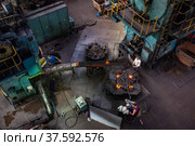 Stepnogorsk, Kazakhstan April 04, 2012: Bearing manufacturing plant. Workshop panorama. Production red-hot outer rings on technology line. Редакционное фото, фотограф Alexey Rezvykh / Фотобанк Лори