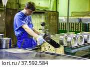 Stepnogorsk, Kazakhstan - April 04, 2012: Bearing production plant. Ready bearings on quality control line. Measuring of imprecision. Редакционное фото, фотограф Alexey Rezvykh / Фотобанк Лори