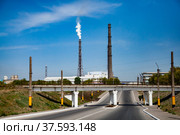 Smoking factory chimney or plant pipe of phosphoric fertilizers plant on blue sky. Old soviet chemical factory. Стоковое фото, фотограф Alexey Rezvykh / Фотобанк Лори