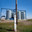 Modern grain storage elevator (on background) and vintage wooden electric pole on front. Стоковое фото, фотограф Alexey Rezvykh / Фотобанк Лори