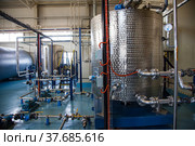 Ekibastuz, Kazakhstan - May 28, 2012. Explosive material production plant for coal quarry mining. Stainless steel tanks and equipment in workshop. Стоковое фото, фотограф Alexey Rezvykh / Фотобанк Лори