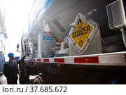 Ekibastuz, Kazakhstan - May 28, 2012. Explosive material production plant for coal quarry mining. Close-up of blasting agent transporter. Focus on warning sign. Редакционное фото, фотограф Alexey Rezvykh / Фотобанк Лори