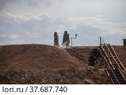 Almaty region, Kazakhstan. Chemist use sodium cyanide NaCN for gold refining. Mining and processing plant. Hazmat suits and gas masks. Стоковое фото, фотограф Alexey Rezvykh / Фотобанк Лори