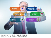 Concept of many different questions asked with businessman. Стоковое фото, фотограф Elnur / Фотобанк Лори