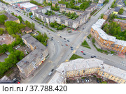 Aerial view on the movement of cars on the ring road. Top view of the city and car junctions. Стоковое фото, фотограф Евгений Ткачёв / Фотобанк Лори