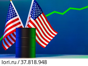 Price of american oil is changing concept. Black barrel with oil and graph. Стоковое фото, фотограф Сергей Толмачёв / Фотобанк Лори