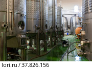 Metallic cisterns for processing and fermentating wine in shop. Стоковое фото, фотограф Яков Филимонов / Фотобанк Лори
