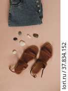 Summer fashion, vacation on sea concept. flat lay composition with sandals and denim shorts top view. Стоковое фото, фотограф Galina kondratenko / Фотобанк Лори