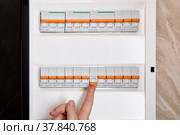 Switching on circuit breaker on panel board it has tripped due to overcurrent (2022 год). Редакционное фото, фотограф Владимир Григорьев / Фотобанк Лори
