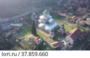 Scenic aerial view of medieval monastic complex of Gelati with partially restored main Cathedral of Nativity of Virgin in spring, Imereti region, Georgia. Стоковое видео, видеограф Яков Филимонов / Фотобанк Лори
