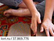 Women's feet stand on a board with sharp nails. Sadhu board. Pain, trials, health, relaxation, cognition. Close-up. Стоковое фото, фотограф Подгорная Юлия / Фотобанк Лори