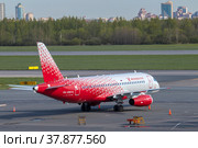 Самолет Сухой Сухой SuperJet 100-95B "Майкоп" (RA-89174) авиакомпании Rossiya - Russian Airlines на летном поле аэропрта Пулково солнечным майским днем. Санкт-Петербург (2022 год). Редакционное фото, фотограф Виктор Карасев / Фотобанк Лори