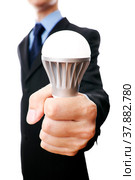 Business man with LED light bulb. Стоковое фото, фотограф Станислав Тарко / Фотобанк Лори