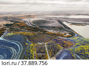 Opencast mining of iron ore. Environmental pollution problems. Стоковое фото, фотограф Евгений Ткачёв / Фотобанк Лори