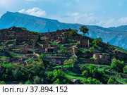 Ruins of houses on a mountainside in Kurib, a depopulated village with the only remaining household with an apiary, Dagestan. Стоковое фото, фотограф Евгений Харитонов / Фотобанк Лори