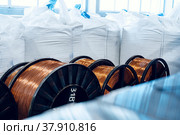 Production of copper wire, cable in reels at factory. Cable factory. Стоковое фото, фотограф Сергей Толмачёв / Фотобанк Лори