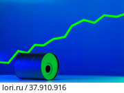 Price of american oil is changing concept. Black barrel with oil and graph. Стоковое фото, фотограф Сергей Толмачёв / Фотобанк Лори