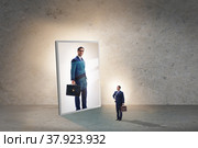 Young businessman in alter ego concept. Стоковое фото, фотограф Elnur / Фотобанк Лори