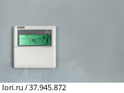 Air conditioner control, thermostat digital programmable on wall. Стоковое фото, фотограф Сергей Толмачёв / Фотобанк Лори