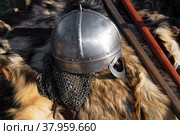 Шлем норманского типа(шлем викингов, реконсрукция)  лежит на шкуре животного. Стоковое фото, фотограф Виктор Карасев / Фотобанк Лори