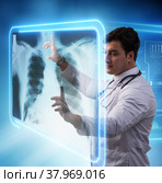 Male doctor studing x-ray image of MRI scan. Стоковое фото, фотограф Elnur / Фотобанк Лори