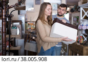 Girl choosing home decor elements in store. Стоковое фото, фотограф Яков Филимонов / Фотобанк Лори