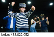 Boy child playfully poses in virtual reality glasses. Стоковое фото, фотограф Яков Филимонов / Фотобанк Лори