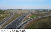 The drone flies over a traffic interchange and opens a panorama. The concept of transport. Стоковое видео, видеограф Ярославский Максим / Фотобанк Лори