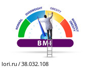 Concept of BMI - body mass index with man. Стоковое фото, фотограф Elnur / Фотобанк Лори