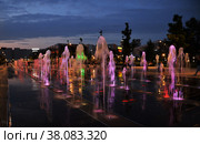 Moscow, Russia, August 28, 2021: Fountain cascade with evening illumination in Khodynskoye field - Moscow park in southern part of historic area of same name. Стоковое фото, фотограф Алексей Антипов / Фотобанк Лори
