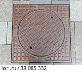 Old rusty sewer hatch on an old metal plate. View from above. Стоковое фото, фотограф Фотограф / Фотобанк Лори