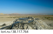 Bursting the bubble mud volcanoes, qobustan, Azerbaijan (2010 год). Редакционное фото, фотограф Сергей Майоров / Фотобанк Лори