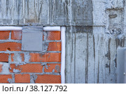 Connection of monolithic structure of building with brickwork of structure is sealed with closed-cell joint sealant. Стоковое фото, фотограф Дмитрий Коростылев / Фотобанк Лори