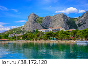 View of the embankment of the Cetina River and the mountains in the town of Omis (2015 год). Стоковое фото, фотограф Михаил Аккуратoв / Фотобанк Лори