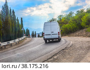 Minibus Moves On Mountain Road. Стоковое фото, фотограф Юрий Бизгаймер / Фотобанк Лори