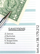 Notebook with pen and one US dollar. Inscription Sanctions and list of targets on notepad sheet. Стоковое фото, фотограф Евгений Ткачёв / Фотобанк Лори