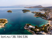 Aerial view of Albanian coast of Ionian Sea overlooking Ksamil cityscape. Стоковое фото, фотограф Яков Филимонов / Фотобанк Лори