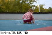 Small cute girl chalking on the playground. Стоковое фото, фотограф Chudakov_Ivan / Фотобанк Лори