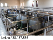 Metallic cisterns for processing and fermentating wine in shop. Стоковое фото, фотограф Яков Филимонов / Фотобанк Лори