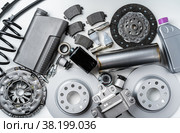 New metal auto parts on grey background. Стоковое фото, фотограф Сергей Толмачёв / Фотобанк Лори