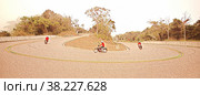 Illustration. Serpentine on mount Phnom Bokor in Cambodia. On asphalt road go motorcyclists. Tourism and travel in Southeast Asia. Стоковая иллюстрация, иллюстратор Aleksandr Golubev / Фотобанк Лори