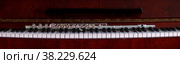 Flute with piano. Flute on piano keys. Wind instrument for musical design of concert creativity. Стоковое фото, фотограф Aleksandr Golubev / Фотобанк Лори