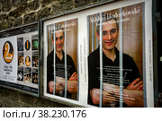 Tallinn, Estonia - October 22, 2013: Portrait of Mikhail Khodorkovsky behind bars on the poster of the theater in the Old city of Tallinn on the fortress wall. Political Prisoners In Russia. Редакционное фото, фотограф Aleksandr Golubev / Фотобанк Лори
