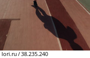 Non-professional athlete runs marathon through an empty stadium. Стоковое видео, видеограф Александр Багно / Фотобанк Лори
