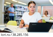 Young female European student studying with a laptop. Стоковое фото, фотограф Яков Филимонов / Фотобанк Лори