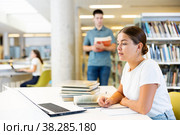 Caucasian school student girl doing research on project laptop. Стоковое фото, фотограф Яков Филимонов / Фотобанк Лори